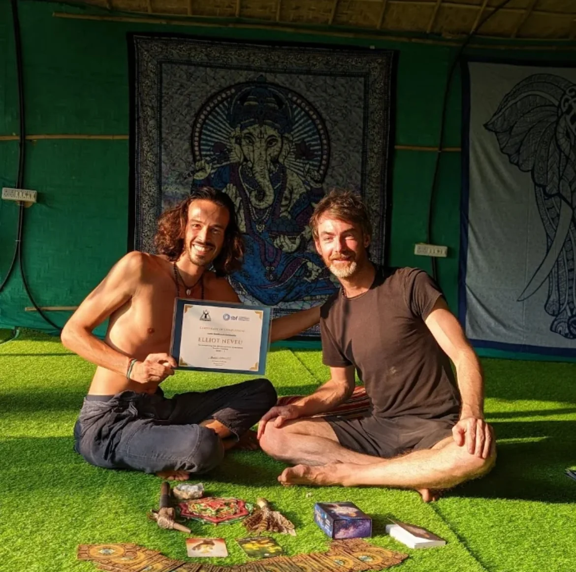 Elliot Amaru holding his International Breathwork Foundation certificate